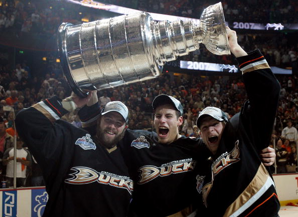 ANAHEIM, CA - JUNE 06:  (L-R) Dustin Penner #17, Ryan Getzlaf #15 and Corey Perry #10 of the Anaheim Ducks celebrate lifting the Stanley Cup after defeating the Ottawa Senators in Game Five of the 2007 Stanley Cup finals on June 6, 2007 at Honda Center in