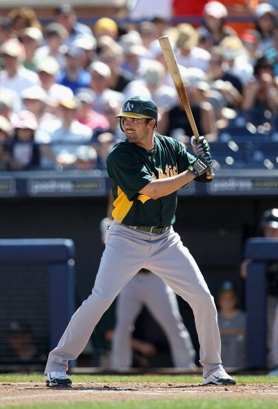 PEORIA, AZ - MARCH 12:  David DeJesus #12 of the Oakland Athletics bats against the Seattle Mariners during the spring training game at Peoria Stadium on March 12, 2011 in Peoria, Arizona.  (Photo by Christian Petersen/Getty Images)
