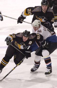 8 Jan 2001:  Martin Straka #82 of the Pittsburgh Penguins is hooked by Sergei Gonchar #55 of the Washington Capitals as Robert Lang #22 of the Penguins follows the play. Straka recorded a hat trick as the Penguins defeated the Capitals 5-3 at the MCI Cent