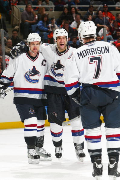 UNIONDALE, NY - JANUARY 14:  Todd Bertuzzi #44 of the Vancouver Canucks celebrates a goal with Markus Naslund #19 and Brendan Morrison #7 against the New York Islanders during their game on January 14, 2006 at the Nassau Coliseum in Uniondale, New York.