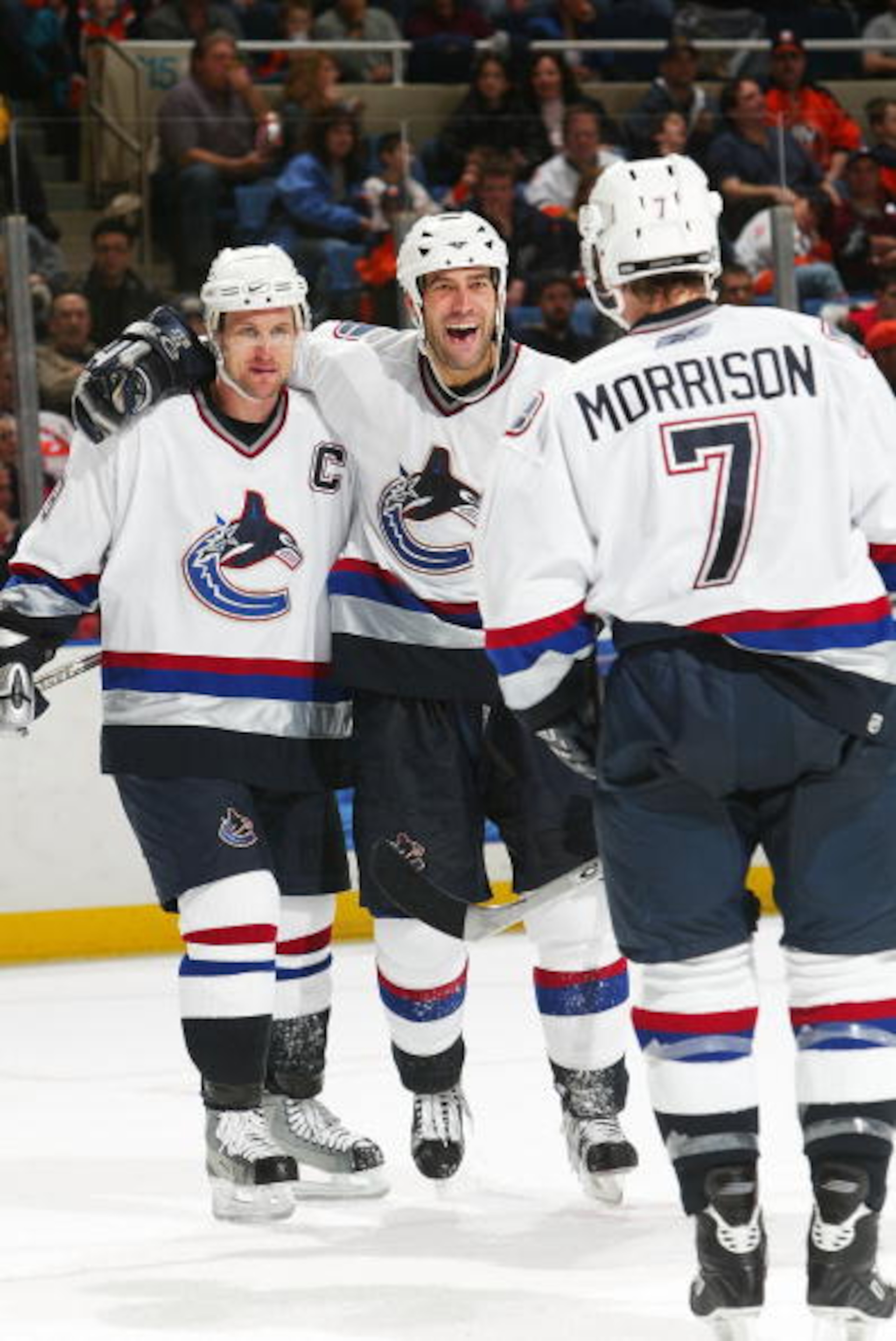 UNIONDALE, NY - JANUARY 14:  Todd Bertuzzi #44 of the Vancouver Canucks celebrates a goal with Markus Naslund #19 and Brendan Morrison #7 against the New York Islanders during their game on January 14, 2006 at the Nassau Coliseum in Uniondale, New York.