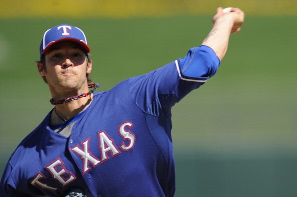 SURPISE, AZ - FEBRUARY 27: C.J. Wilson #36 of the Texas Rangers pitches during a spring training game against the Kansas City Royals at Surprise Stadium on February 27, 2011 in Surprise, Arizona. (Photo by Rob Tringali/Getty Images)