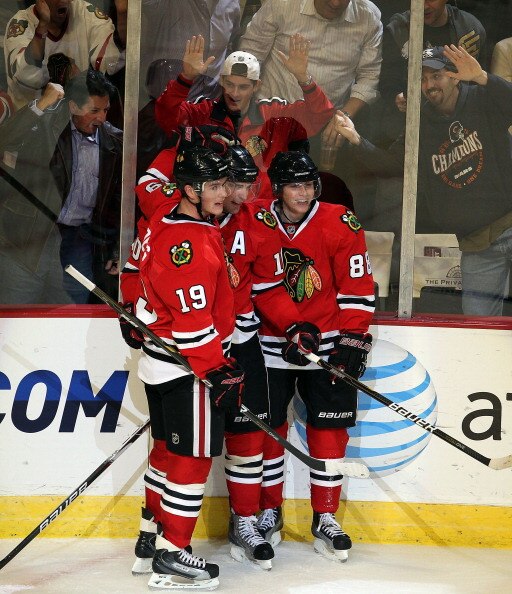 CHICAGO - OCTOBER 27: (L-R) Jonathan Toews #19, Patrick Sharp #10 and Patrick Kane #88 of the Chicago Blackhawks celebrate a 3rd period goal by Sharp against the Los Angeles Kings at the United Center on October 27, 2010 in Chicago, Illinois. The Blackhaw