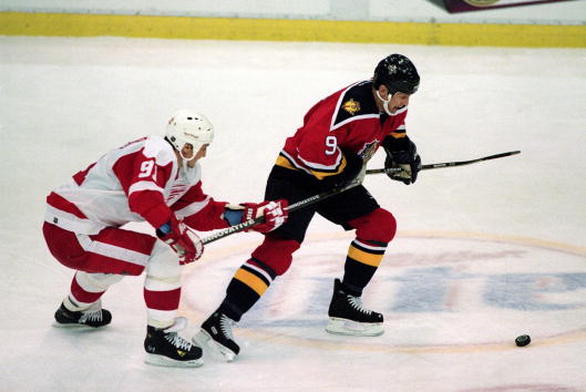 13 Dec 2000:  Igor Larionov #9 of the Florida Panthers tries to steal the puck from Sergei Fedorov #91 of the Detroit Red Wings during the game at the Joe Louis Arena in Detroit, Michigan. The Panthers tied the Red Wings 3-3.Mandatory Credit: Tom Pidgeon/