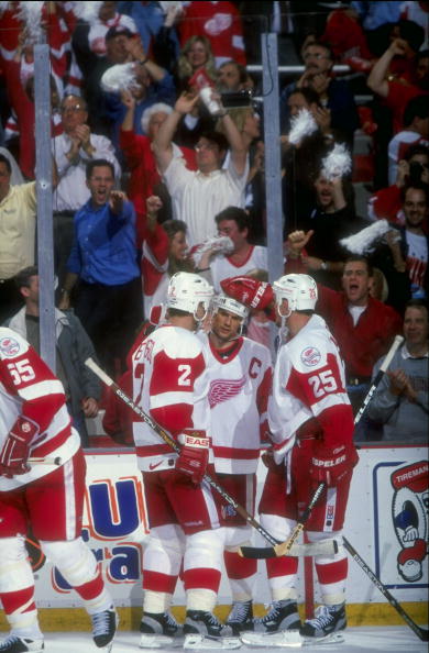 11 Jun 1998:  Steve Yzerman #19, Viacheslav Fetisov #2, and Darren McCarty #25 of the Detroit Red Wings talk during the Stanley Cup Finals game against the Washington Capitals at the Joe Louis Arena in Detroit, Michigan. The Red Wings defeated the Capital
