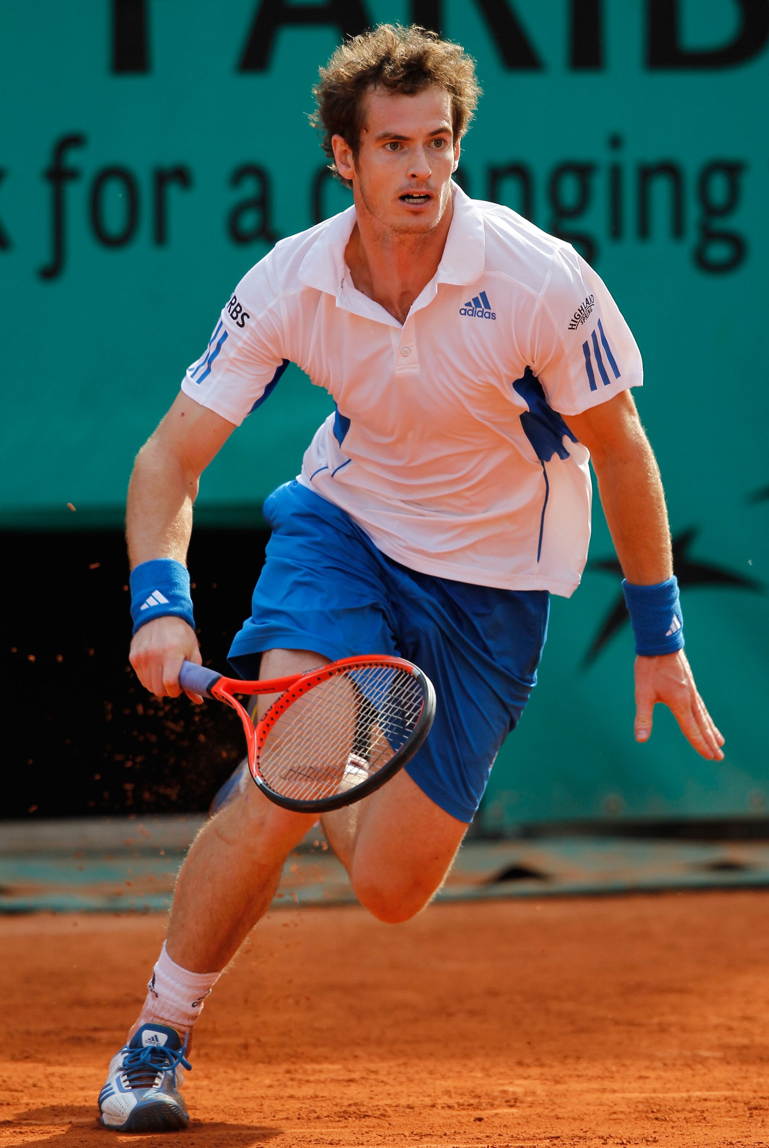 PARIS - MAY 28:  Andy Murray of Great Britain charges to the net during the men's singles third round match between Andy Murray of Great Britain and Marcos Baghdatis of Cyprus on day six of the French Open at Roland Garros on May 28, 2010 in Paris, France