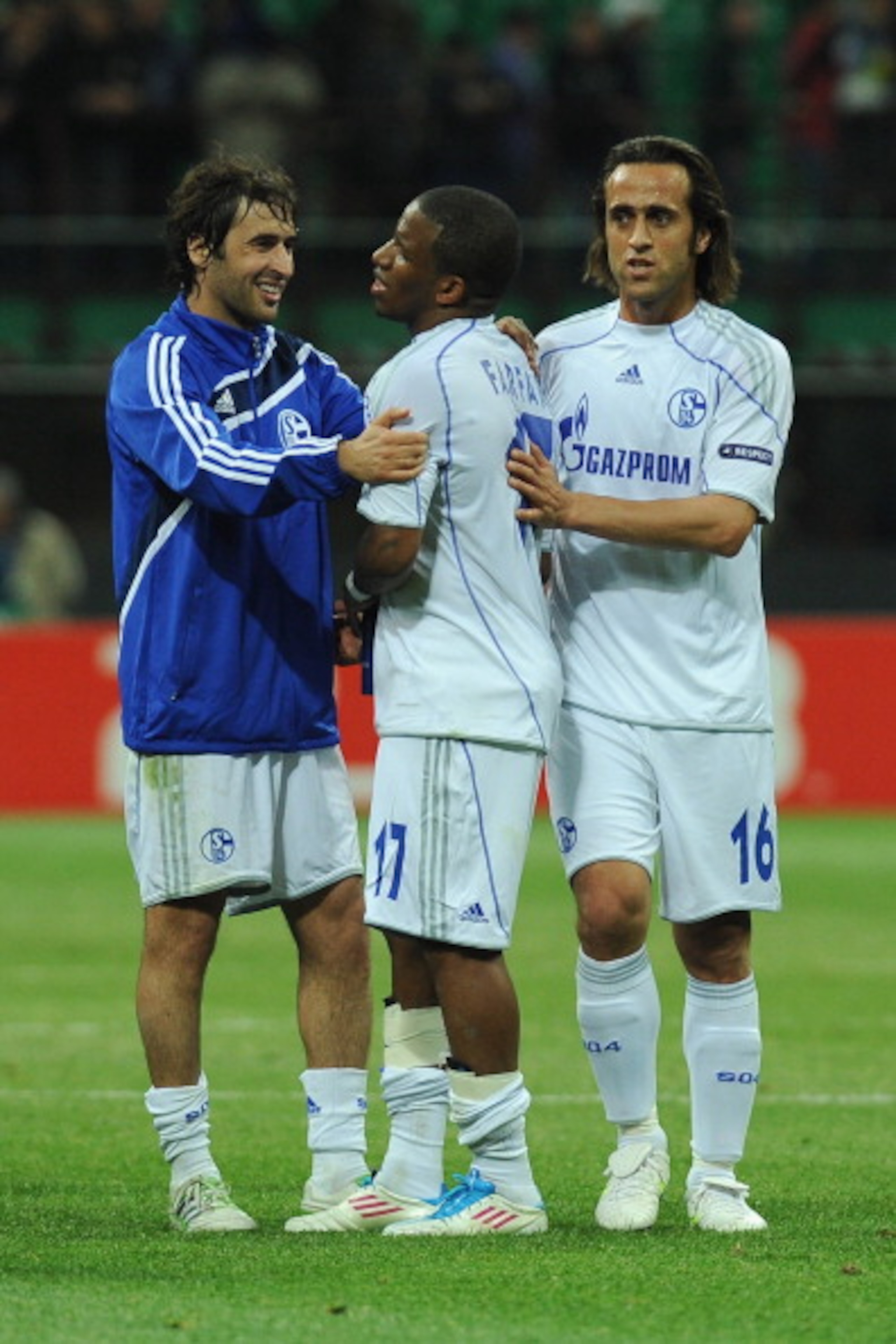 MILAN, ITALY - APRIL 05:  Raul (L), Jefferson Farfan (C) and Ali Karimi of Schalke 04 celebrate victory at the end of the UEFA Champions League Quarter Final match between FC Internazionale Milano and Schalke 04 at San Siro Stadium on April 5, 2011 in Mil