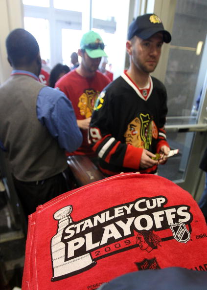 CHICAGO - MAY 24:  Ushers hand out Playoff rally towels to fans as they enter the arena prior to Game Four of the Western Conference Championship Round of the 2009 Stanley Cup Playoffs between the Chicago Blackhawks and the Detroit Red Wings on May 24, 20
