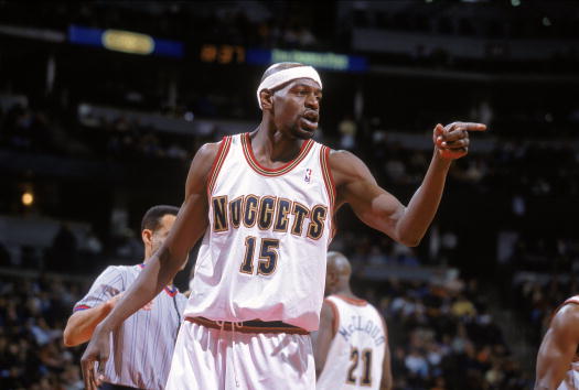 20 Dec 2000:  Keon Clark #15 of the Denver Nuggets points on the court during the game against the  Detroit Pistons  at the Pepsi Center in Denver, Colorado. The Nuggets defeated the Pistons 106-108.    NOTE TO USER: It is expressly understood that the on