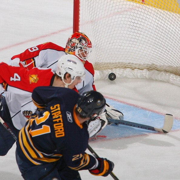 BUFFALO, NY - MARCH 25: Drew Stafford #21 of the Buffalo Sabres watches his shot hit the back of the net for a goal against Keaton Ellerby #4 and Tomas Vokoun #29 of the Florida Panthers at HSBC Arena on March 25, 2011 in Buffalo, New York. Buffalo won 4-