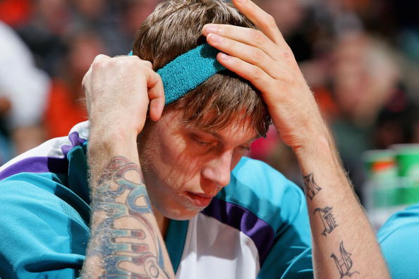 CHARLOTTE, NC - DECEMBER 14:  Chris Andersen #12 of the New Orleans Hornets holds his head after a 94-93 loss to the Charlotte Bobcats on December 14, 2004 at the Charlotte Coliseum in Charlotte, North Carolina.  NOTE TO USER: User expressly acknowledges