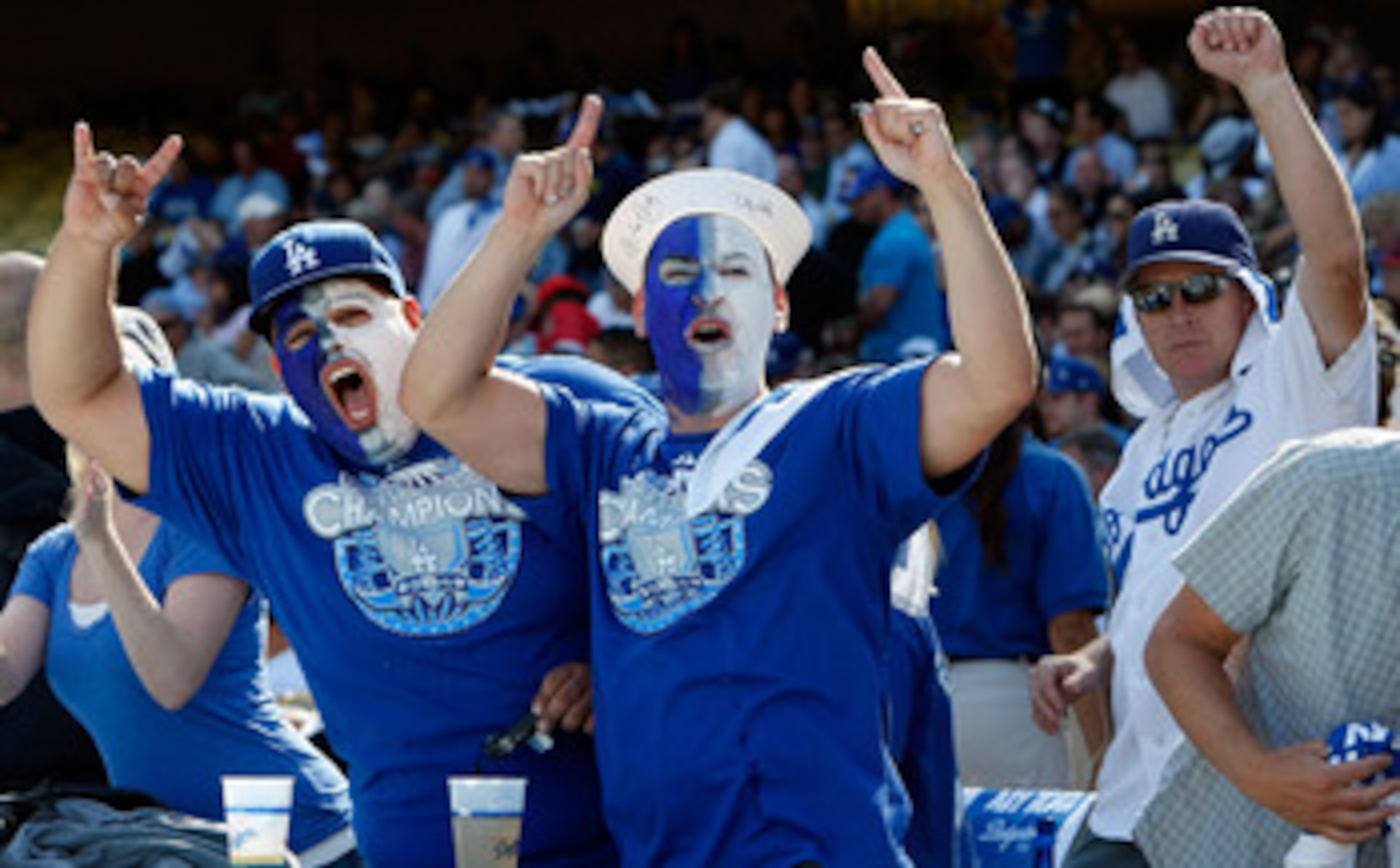 LOS ANGELES, CA - OCTOBER 08:  Fans of the Los Angeles Dodgers cheer on their team against the St. Louis Cardinals in Game Two of the NLDS during the 2009 MLB Playoffs at Dodger Stadium on October 8, 2009 in Los Angeles, California.  (Photo by Jeff Gross/