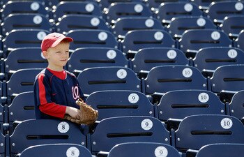 WASHINGTON, DC - APRIL 03:  A young fan watches batting practice before the start of the Atlanta Braves and Washington Nationals game at Nationals Park on April 3, 2011 in Washington, DC.  (Photo by Rob Carr/Getty Images)