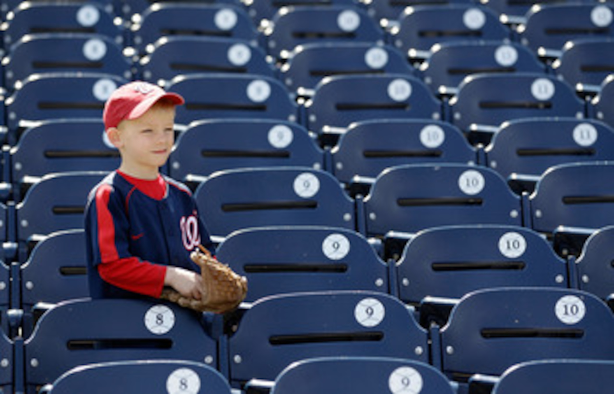 WASHINGTON, DC - APRIL 03:  A young fan watches batting practice before the start of the Atlanta Braves and Washington Nationals game at Nationals Park on April 3, 2011 in Washington, DC.  (Photo by Rob Carr/Getty Images)