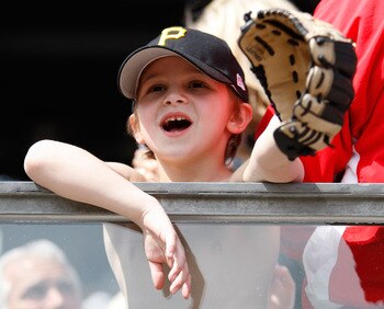 PITTSBURGH - APRIL 07:  A young fan looks to get a ball during the Opening Day game between the Pittsburgh Pirates and the Colorado Rockies on April 7, 2011 at PNC Park in Pittsburgh, Pennsylvania.  (Photo by Jared Wickerham/Getty Images)