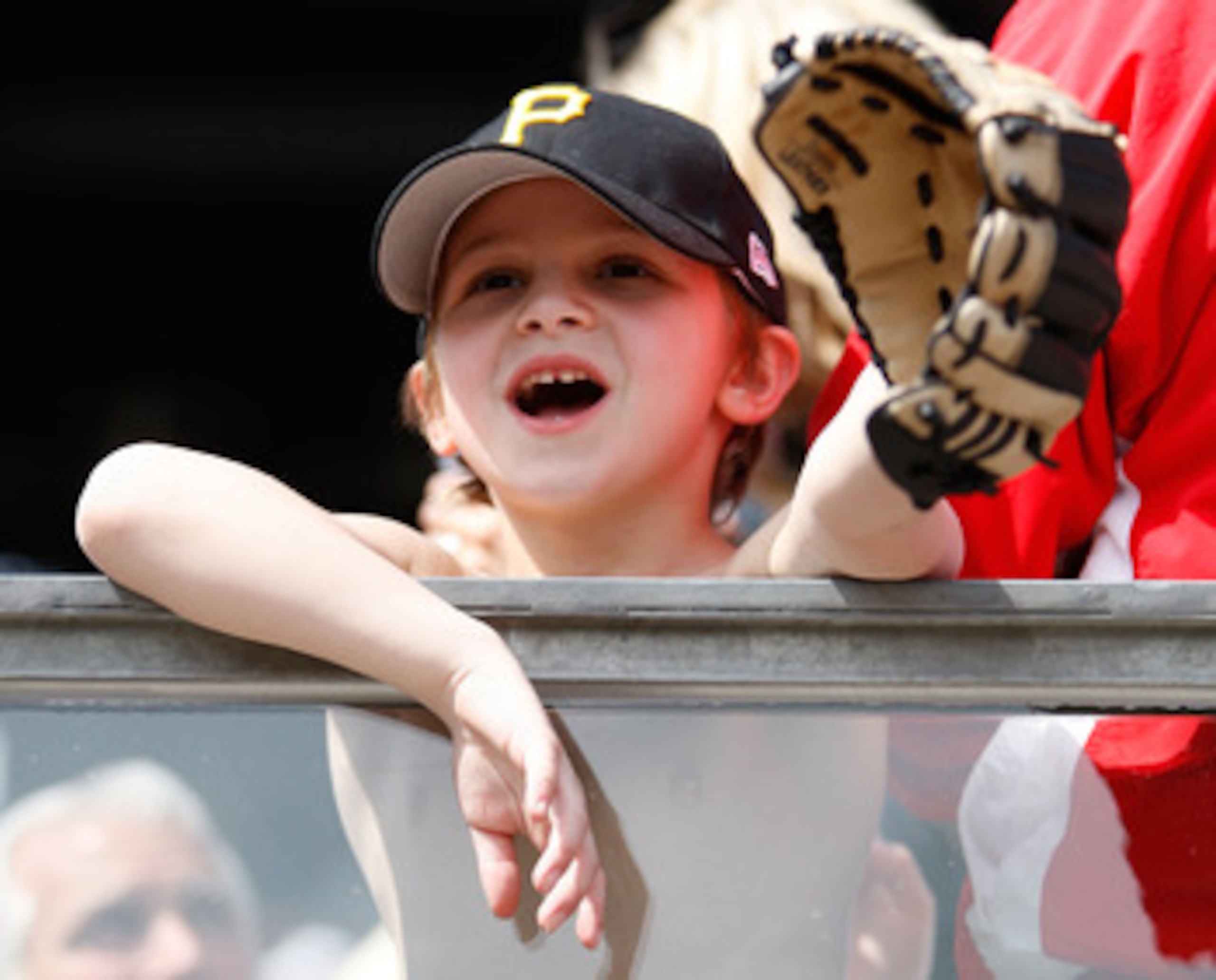 PITTSBURGH - APRIL 07:  A young fan looks to get a ball during the Opening Day game between the Pittsburgh Pirates and the Colorado Rockies on April 7, 2011 at PNC Park in Pittsburgh, Pennsylvania.  (Photo by Jared Wickerham/Getty Images)