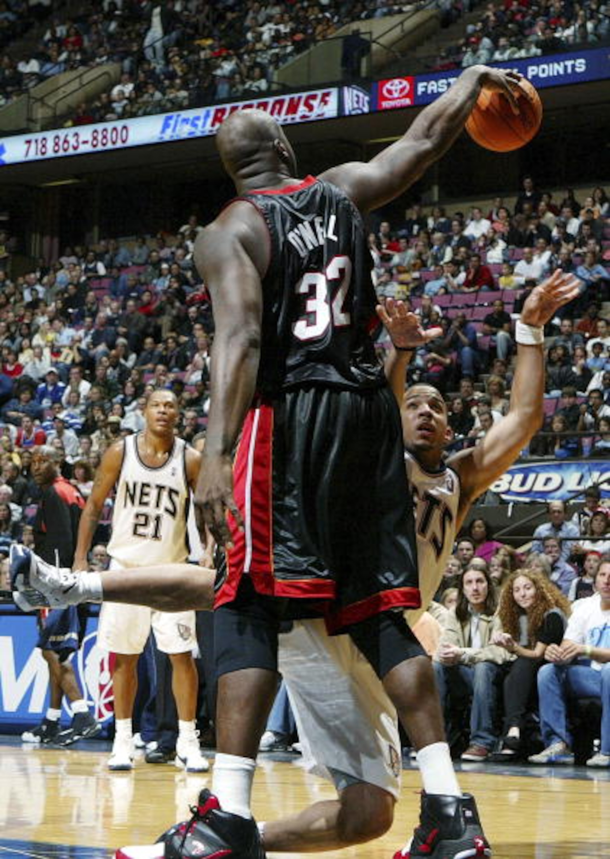 EAST RUTHERFORD, NJ - NOVEMBER 10: Shaquille O'Neal #32 of the Miami Heat commits a foul against Marcus Williams #1 of the New Jersey Nets during their game on November 10, 2006 at Continental Airlines Arena in East Rutherford, New Jersey. NOTE TO USER: U EAST RUTHERFORD, NJ - NOVEMBER 10: Shaquille O'Neal #32 of the Miami Heat commits a foul against Marcus Williams #1 of the New Jersey Nets during their game on November 10, 2006 at Continental Airlines Arena in East Rutherford, New Jersey. NOTE TO USER: U
