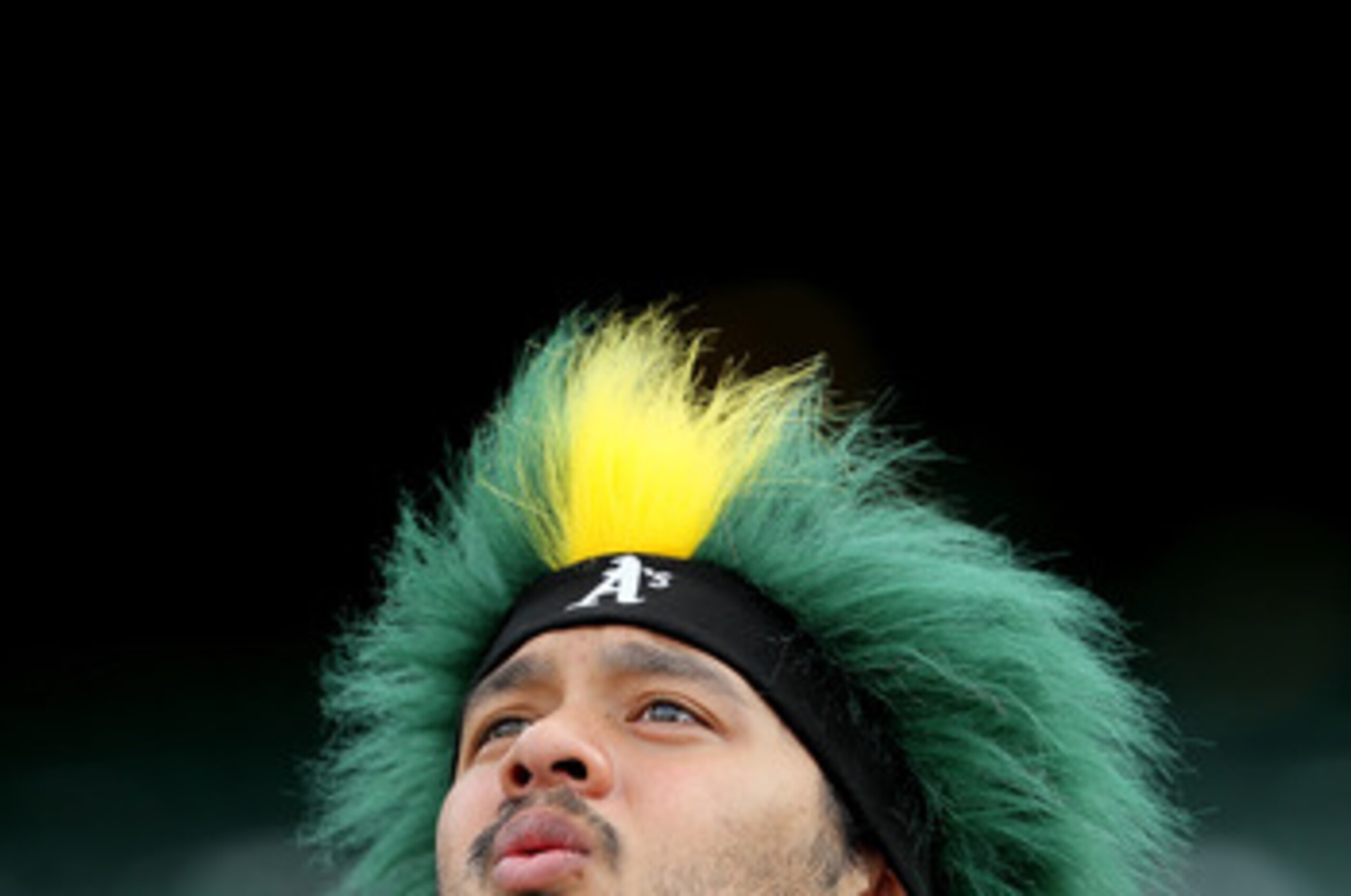 OAKLAND, CA - APRIL 01:  A fan looks on before the start of the Opening Day game with the Oakland Athletics and the Seattle Mariners at the Oakland-Alameda County Coliseum on April 1, 2011 in Oakland, California  (Photo by Justin Sullivan/Getty Images)