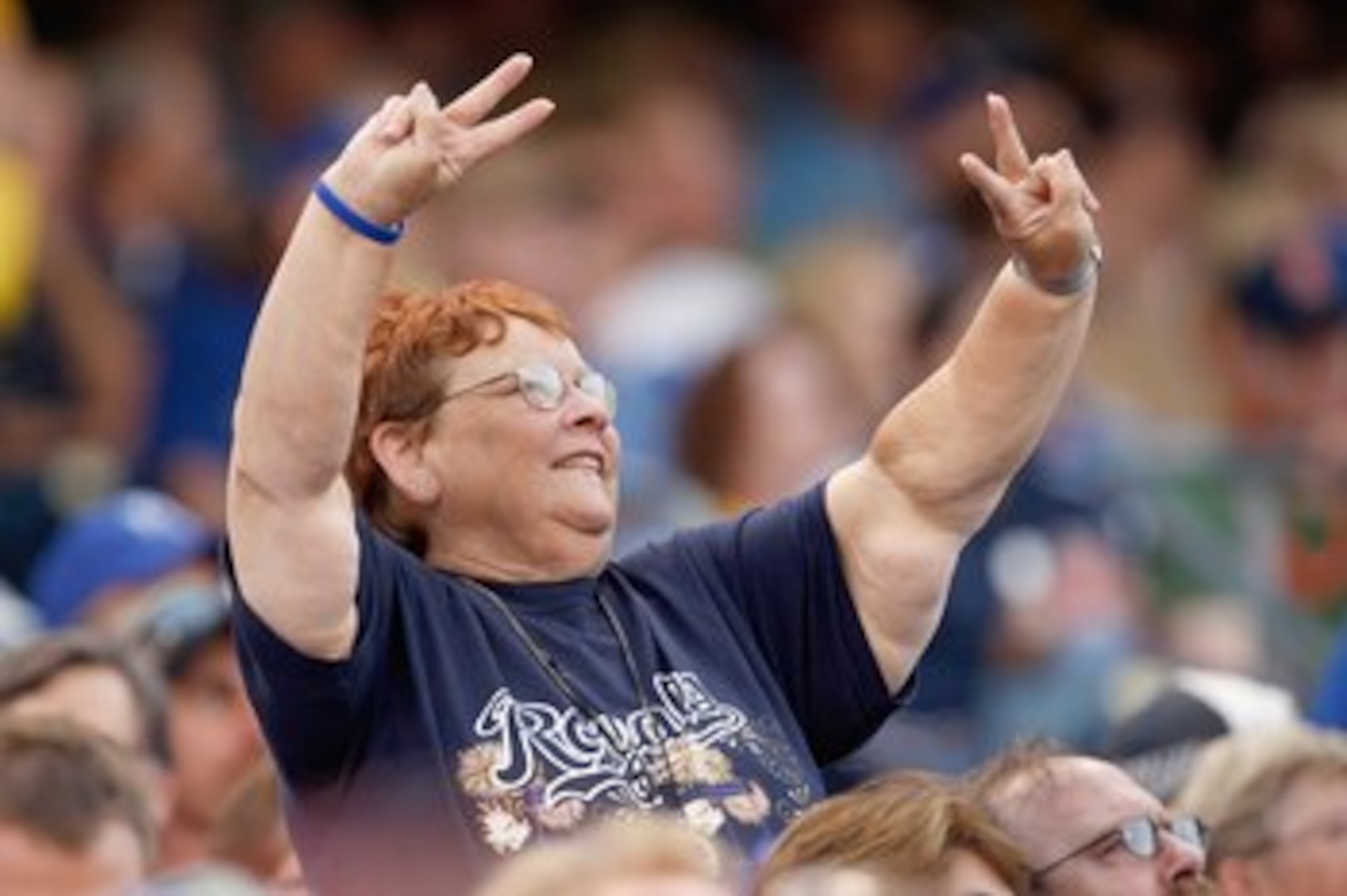 KANSAS CITY - JUNE 12:  A fan of the Kansas City Royals cheers in the stands during the game against the Cincinnati Reds on June 12, 2009 at Kauffman Stadium in Kansas City, Missouri. (Photo by Jamie Squire/Getty Images)