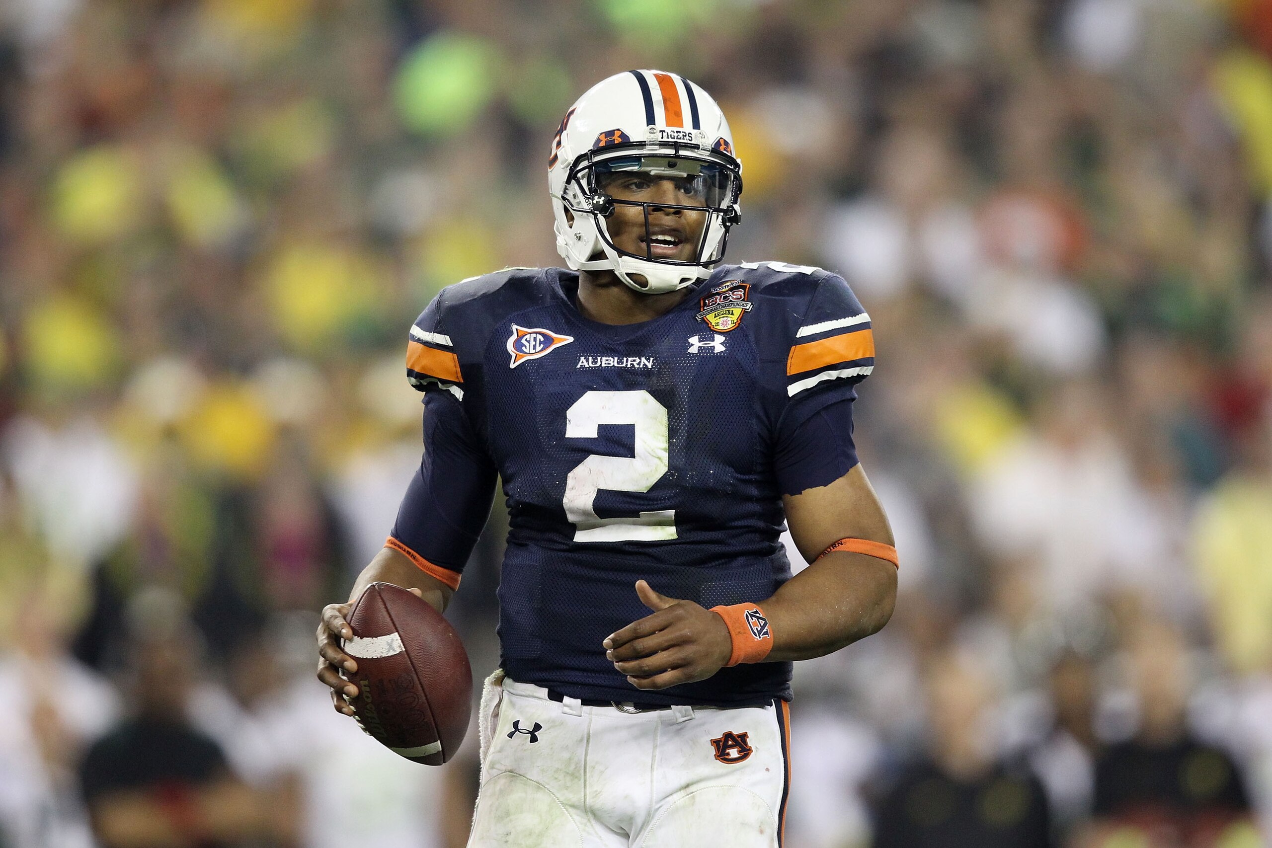 GLENDALE, AZ - JANUARY 10: Cameron Newton #2 of the Auburn Tigers scrambles against the Oregon Ducks during the Tostitos BCS National Championship Game at University of Phoenix Stadium on January 10, 2011 in Glendale, Arizona. (Photo by Christian Peters GLENDALE, AZ - JANUARY 10: Cameron Newton #2 of the Auburn Tigers scrambles against the Oregon Ducks during the Tostitos BCS National Championship Game at University of Phoenix Stadium on January 10, 2011 in Glendale, Arizona. (Photo by Christian Peters
