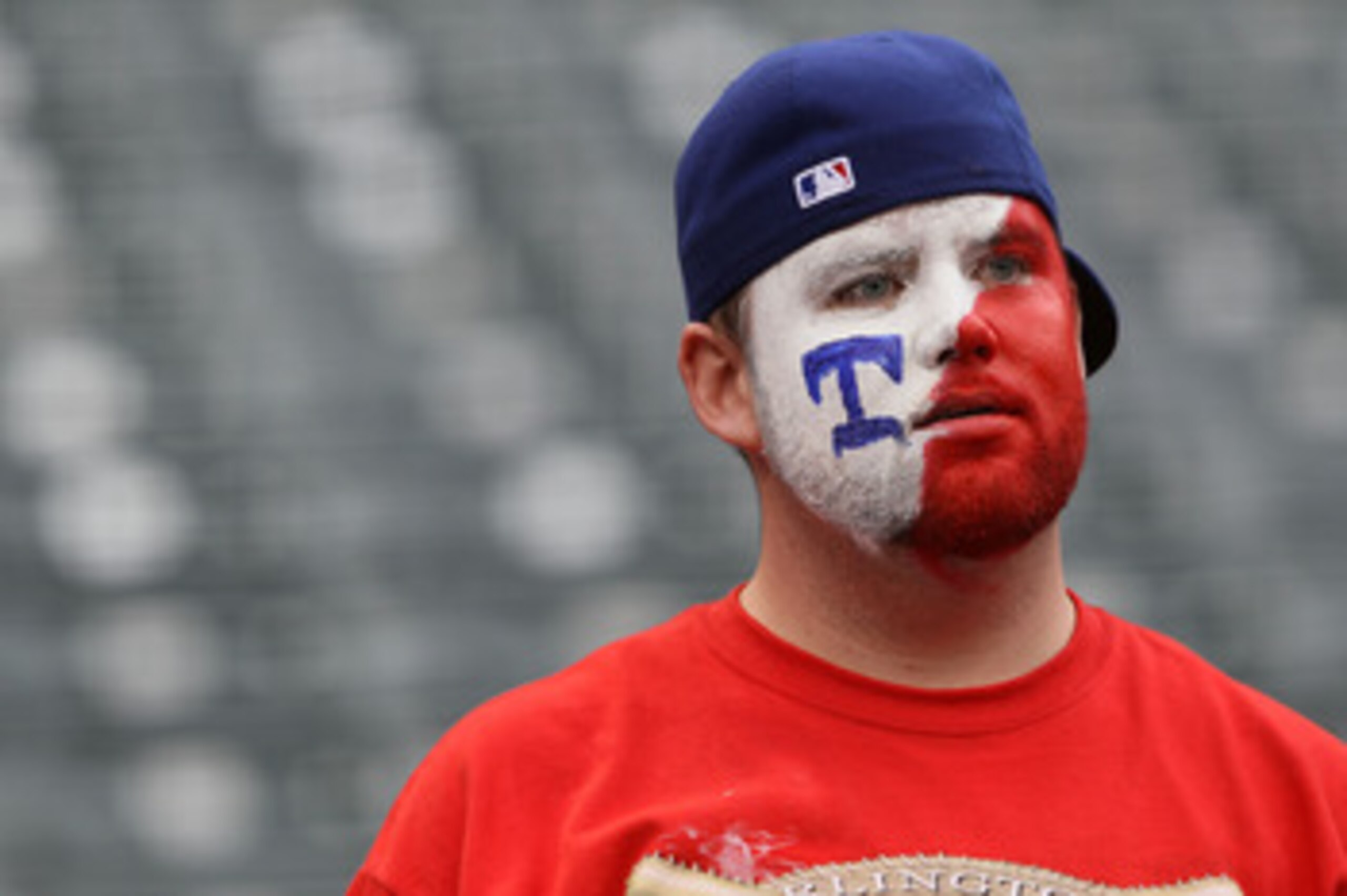 ARLINGTON, TX - OCTOBER 22:  A fan of the Texas Rangers looks on prior to the Rangers playing the New York Yankees in Game Six of the ALCS during the 2010 MLB Playoffs at Rangers Ballpark in Arlington on October 22, 2010 in Arlington, Texas.  (Photo by El