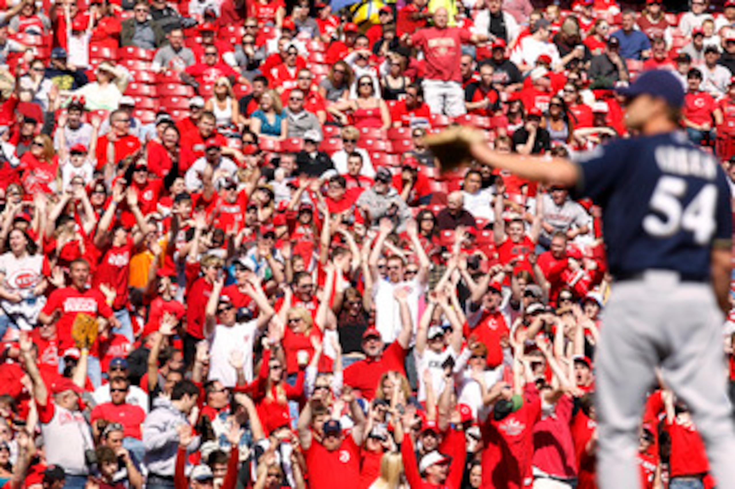 CINCINNATI, OH - APRIL 3: Cincinnati Reds fans cheer late in the game against the Milwaukee Brewers at Great American Ball Park on April 3, 2011 in Cincinnati, Ohio. The Reds won 12-3 to finish off a three-game sweep. (Photo by Joe Robbins/Getty Images)