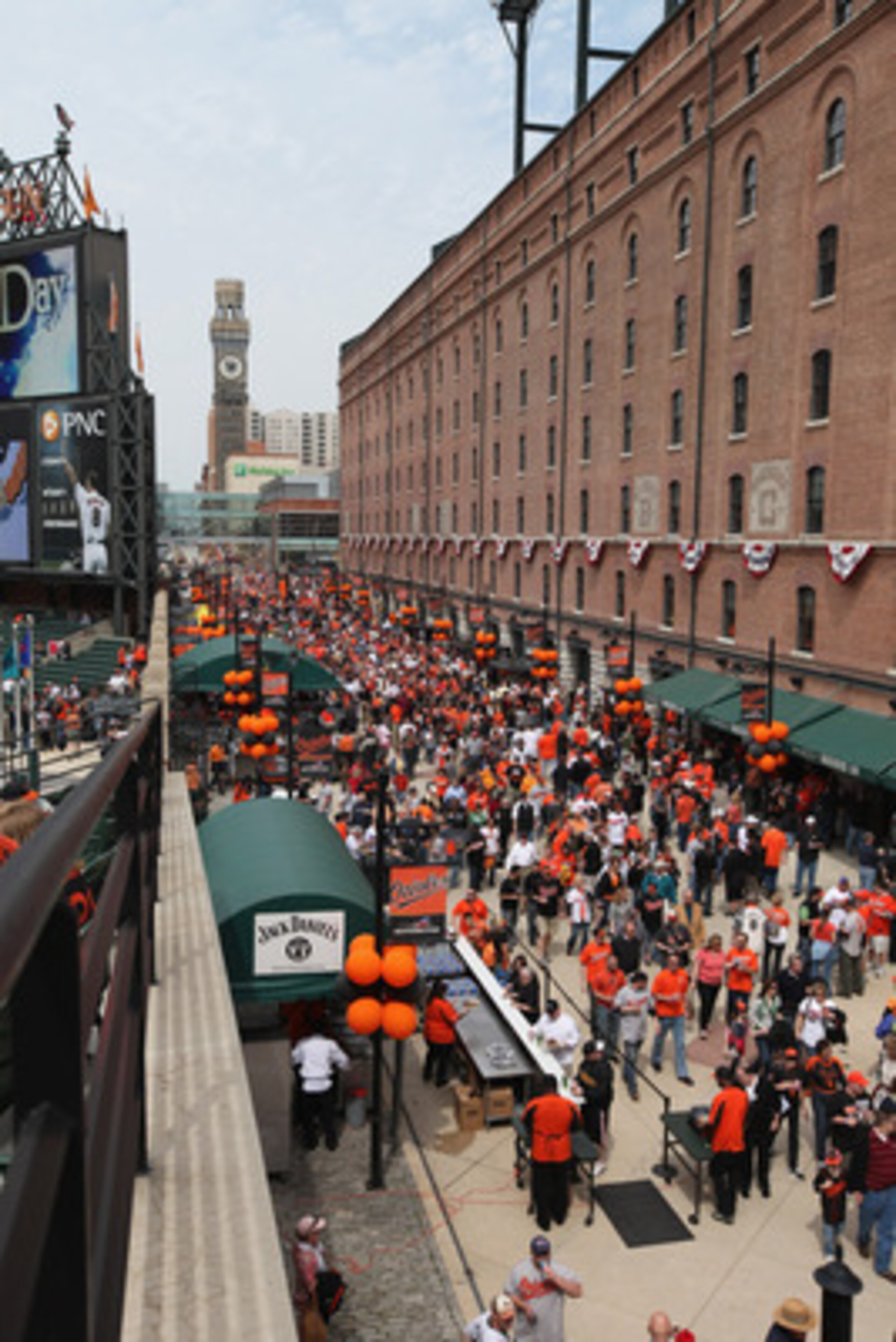 BALTIMORE, MD - APRIL 04:  Fans enter Oriole Park at Camden Yards during opening day between the Baltimore Orioles and the Detroit Tigers on April 4, 2011 in Baltimore, Maryland.  (Photo by Rob Carr/Getty Images)