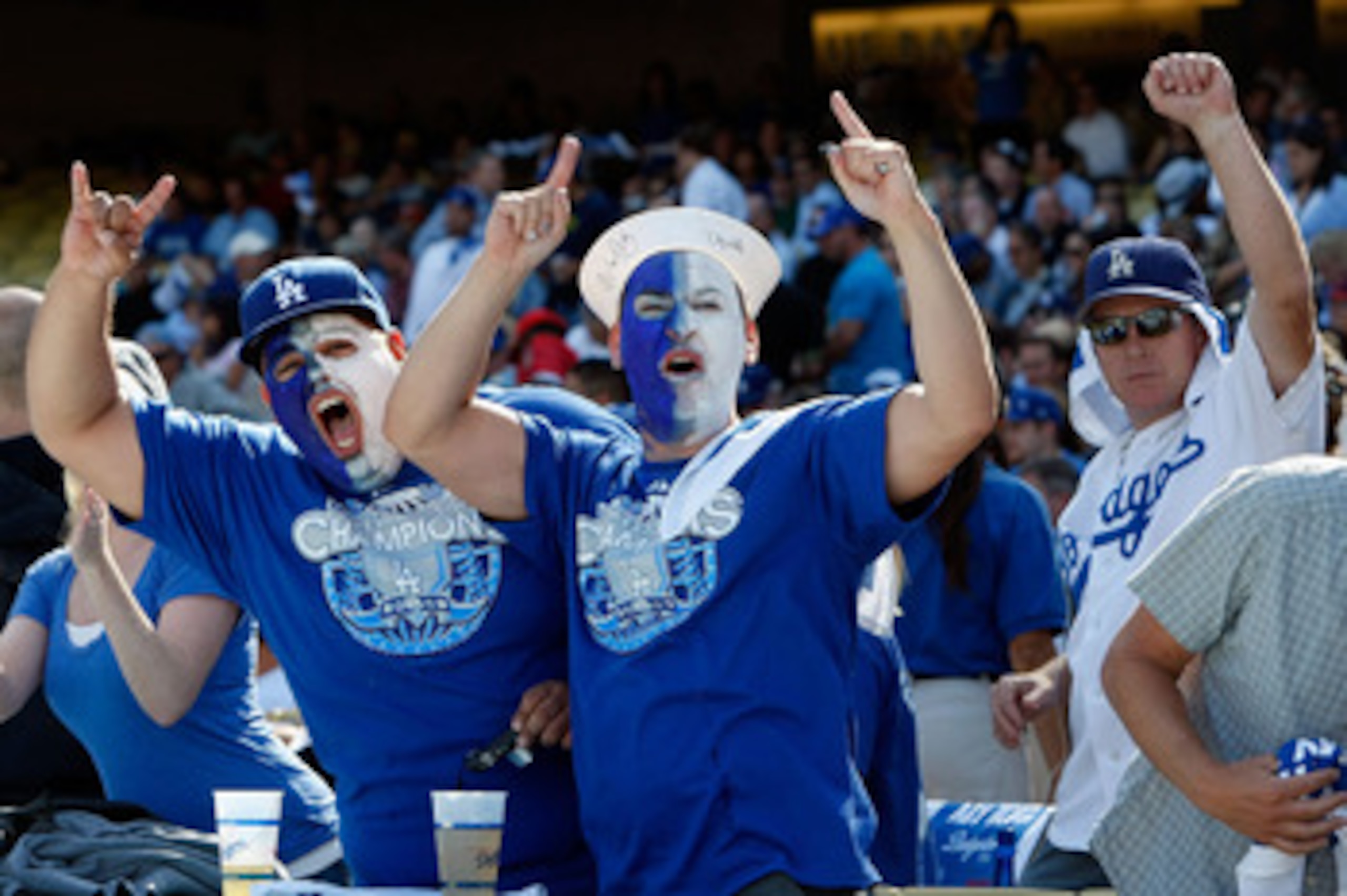 LOS ANGELES, CA - OCTOBER 08:  Fans of the Los Angeles Dodgers cheer on their team against the St. Louis Cardinals in Game Two of the NLDS during the 2009 MLB Playoffs at Dodger Stadium on October 8, 2009 in Los Angeles, California.  (Photo by Jeff Gross/
