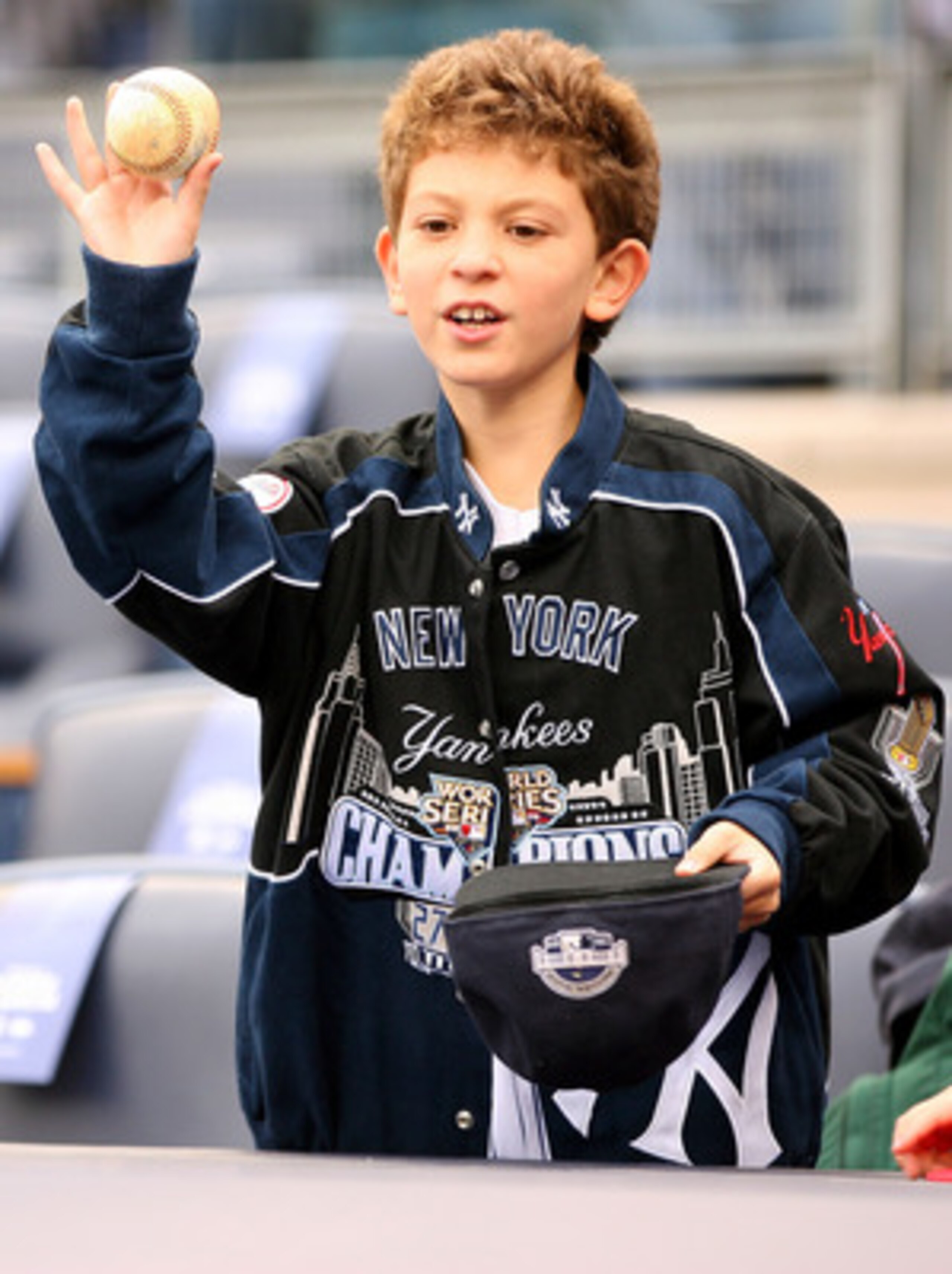NEW YORK - OCTOBER 20:  Young fans attempt to get autographs from members of the New York Yankees during batting practice against the Texas Rangers in Game Five of the ALCS during the 2010 MLB Playoffs at Yankee Stadium on October 20, 2010 in the Bronx bo