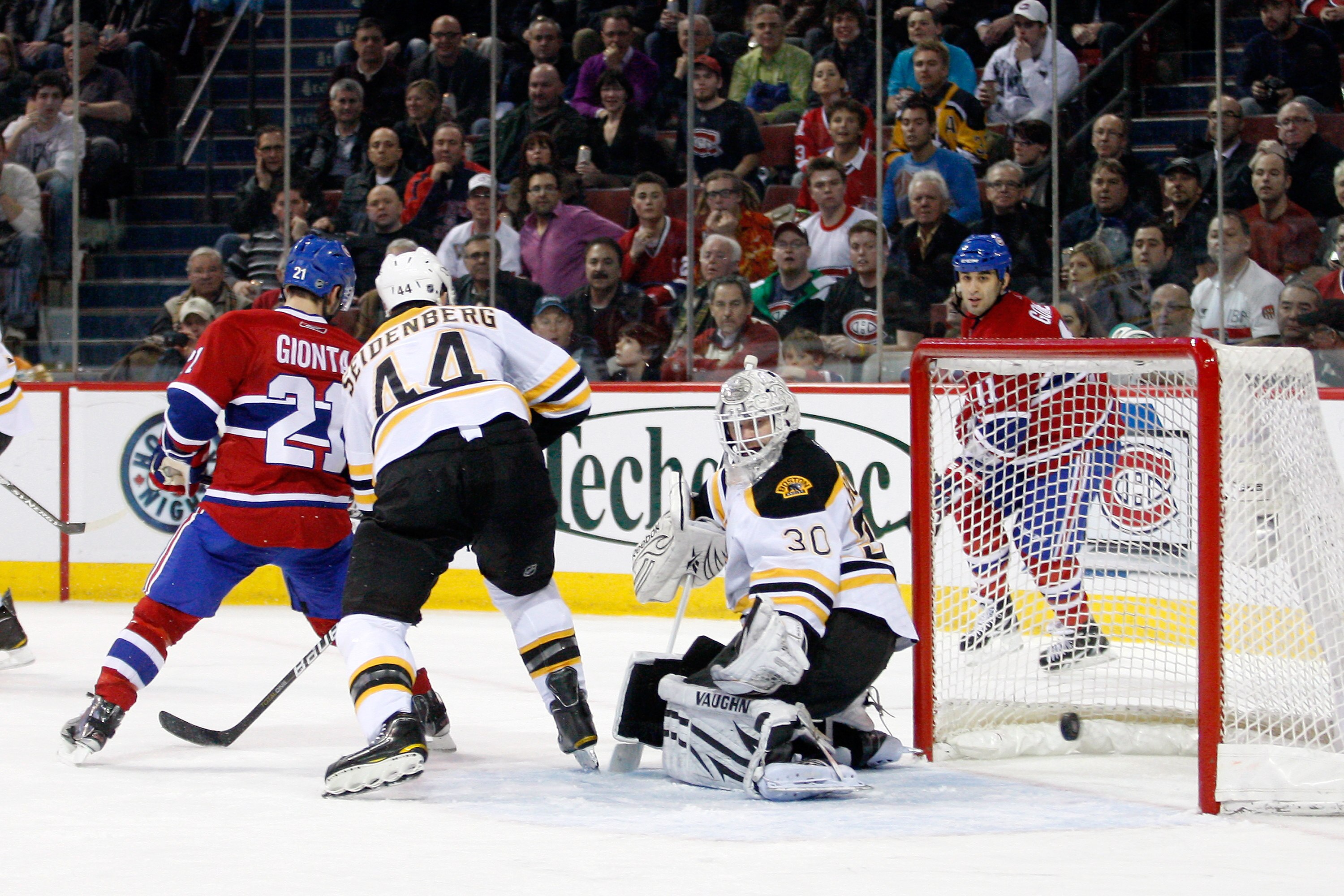 MONTREAL, CANADA - DECEMBER 16:  Brian Gionta #21 of the Montreal Canadiens scores a second period goal on Tim Thomas #30 of the Boston Bruins during the NHL game at the Bell Centre on December 16, 2010 in Montreal, Quebec, Canada.  (Photo by Richard Wolo