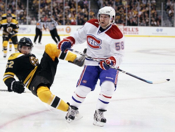 BOSTON, MA - FEBRUARY 09:  David Desharnais #58 of the Montreal Canadiens shoves Zach Hamill #52 of the Boston Bruins on February 9, 2011 at the TD Garden in Boston, Massachusetts. The Bruins defeated the Canadiens 8-6.  (Photo by Elsa/Getty Images)