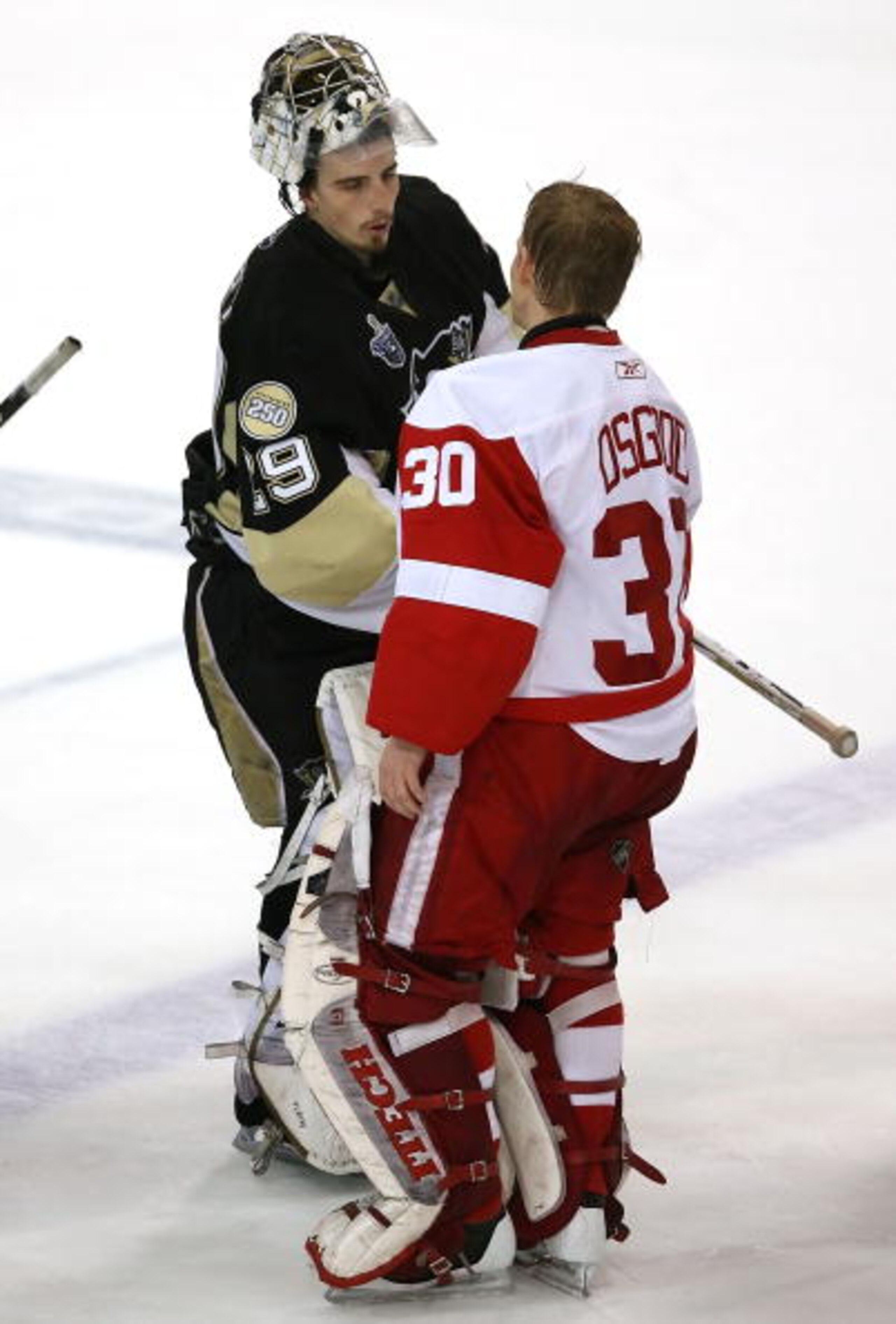 PITTSBURGH - JUNE 04:  Goaltender Chris Osgood #30 of the Detroit Red Wings congratulates Marc-Andre Fleury #29 of the Pittsburgh Penguins after game six of the 2008 NHL Stanley Cup Finals at Mellon Arena on June 4, 2008 in Pittsburgh. Pennsylvania. The R