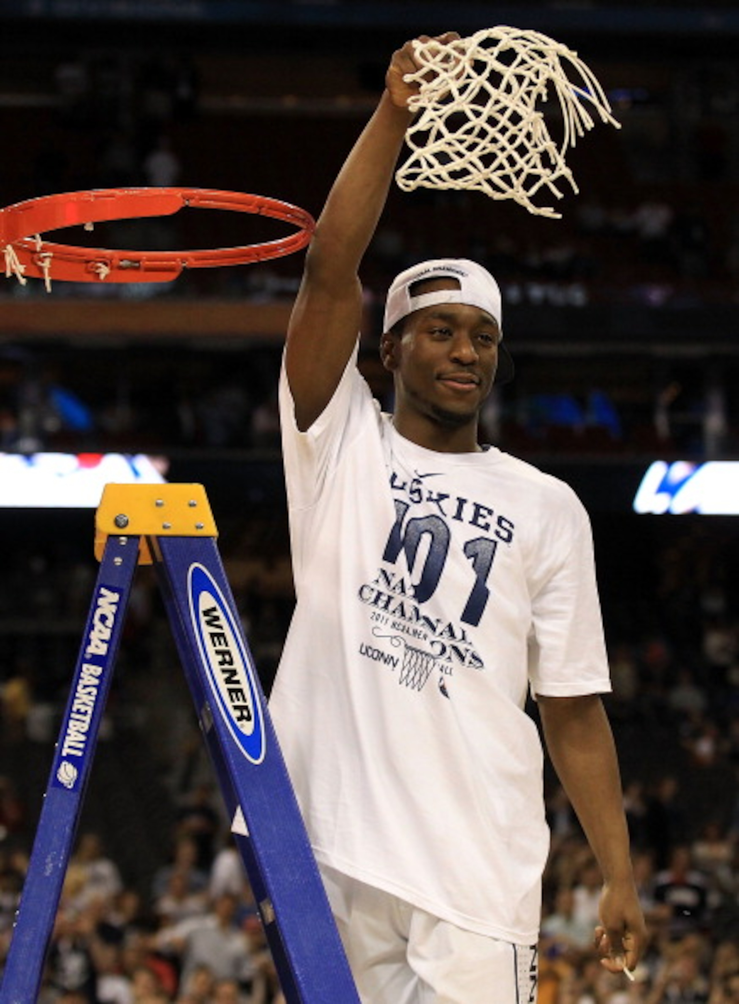 HOUSTON, TX - APRIL 04:  Kemba Walker #15 of the Connecticut Huskies cuts down the net after defeating the Butler Bulldogs to win the National Championship Game of the 2011 NCAA Division I Men's Basketball Tournament by a score of 53-41 at Reliant Stadium
