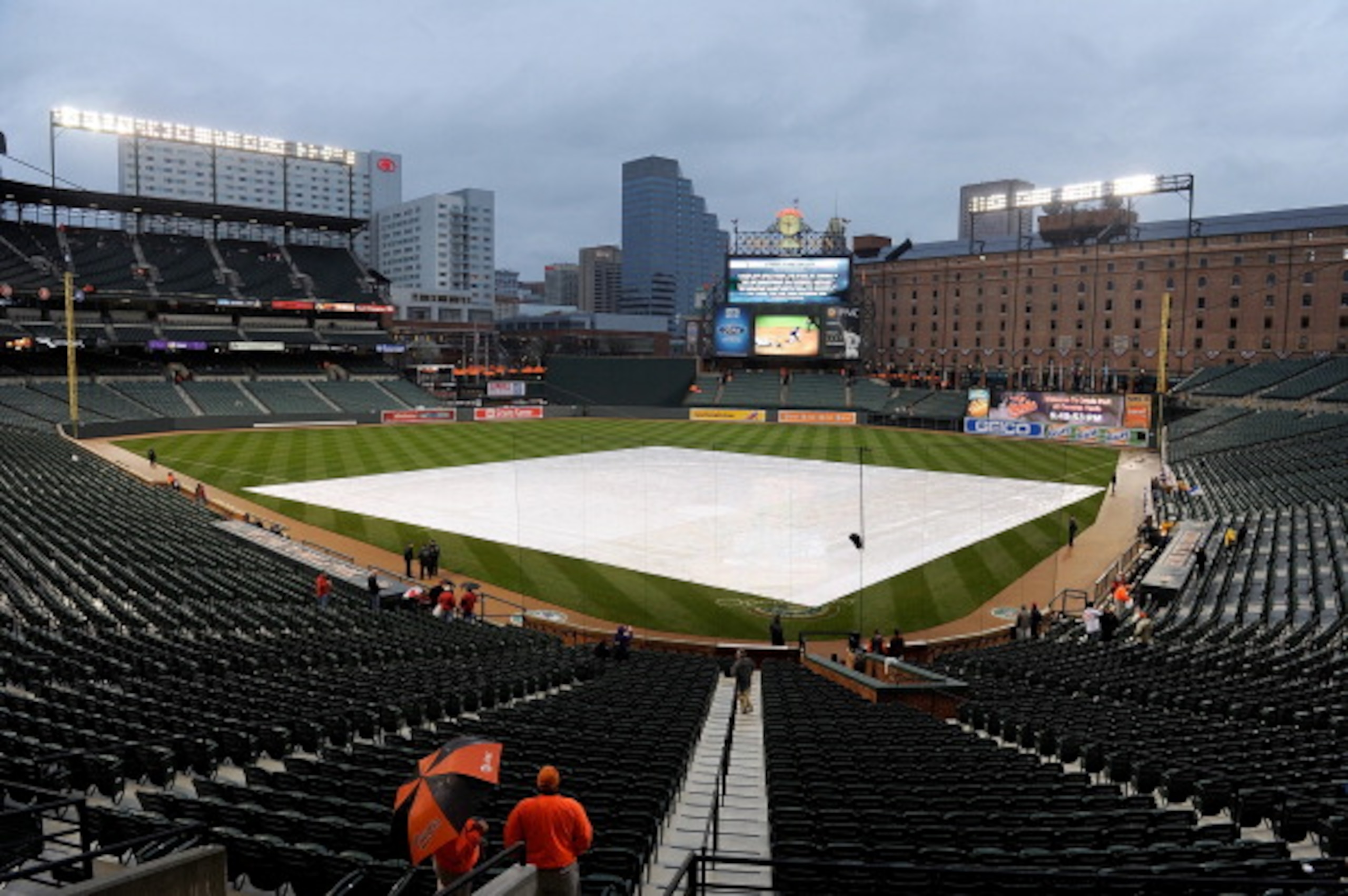 BALTIMORE, MD - APRIL 08: A tarp covers the field before the game between the Baltimore Orioles and the Texas Rangers at Oriole Park at Camden Yards on April 8, 2011 in Baltimore, Maryland. The start of the game has been delayed due to rain. (Photo by Gr BALTIMORE, MD - APRIL 08: A tarp covers the field before the game between the Baltimore Orioles and the Texas Rangers at Oriole Park at Camden Yards on April 8, 2011 in Baltimore, Maryland. The start of the game has been delayed due to rain. (Photo by Gr