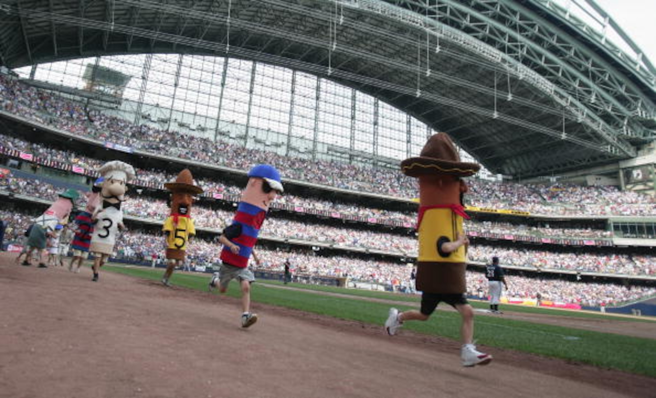 MILWAUKEE - JULY 22: The Sausage Race takes place during the San Francisco Giants game against the Milwaukee Brewers on July 22, 2007 at Miller Park in Milwaukee, Wisconsin. The Brewers won 7-5. (Photo by Jonathan Daniel/Getty Images) MILWAUKEE - JULY 22: The Sausage Race takes place during the San Francisco Giants game against the Milwaukee Brewers on July 22, 2007 at Miller Park in Milwaukee, Wisconsin. The Brewers won 7-5. (Photo by Jonathan Daniel/Getty Images)