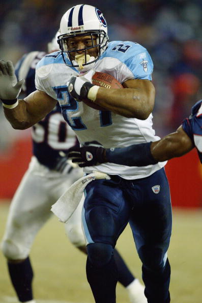 FOXBORO, MA - JANUARY 10:  Running back Eddie George #27 of the Tennessee Titans carries the football against the New England Patriots in the AFC divisional playoffs on January 10, 2004 at Gillette Stadium in Foxboro, Massachusetts. The Patriots won 17-14
