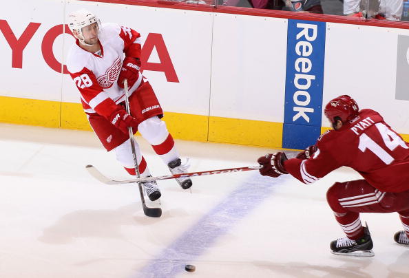 GLENDALE, AZ - APRIL 16:  Brian Rafalski #28 of the Detroit Red Wings passes the puck in Game Two of the Western Conference Quarterfinals against the Phoenix Coyotes during the 2010 NHL Stanley Cup Playoffs at Jobing.com Arena on April 16, 2010 in Glendal
