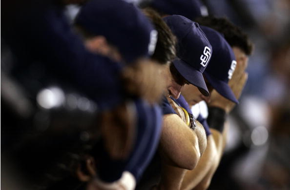 SAN DIEGO, CA - SEPTEMBER 26:  Members of the San Diego Padres look down in the dugout after their 3-2 loss to  the Giants during their MLB game on September 26, 2005 at Petco Park in San Diego, California.  (Photo by Donald Miralle/Getty Images)