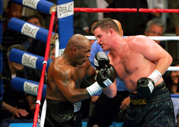 WASHINGTON - JUNE 11:  Kevin McBride (R) of Ireland hits Mike Tyson against the ropes in the 6th round during their heavyweight bout on June 11, 2005 at the MCI Center in Washington, DC.  (Photo By Jamie Squire/Getty Images)