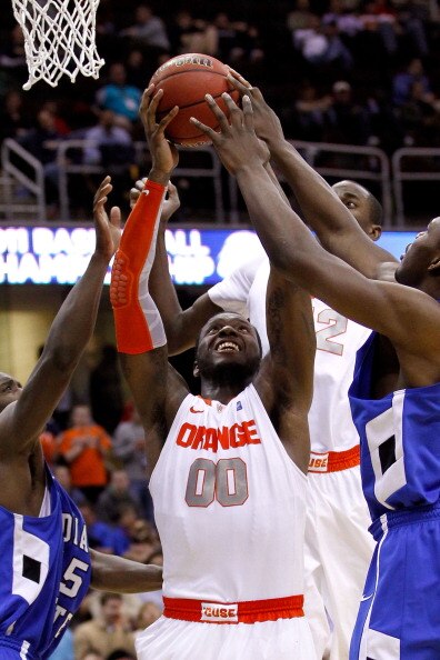 CLEVELAND, OH - MARCH 18: Rick Jackson #00 of the Syracuse Orange tries to pull down a rebound against the Indiana State Sycamores during the second round of the 2011 NCAA men's basketball tournament at Quicken Loans Arena on March 18, 2011 in Cleveland,