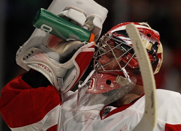 CHICAGO, IL - APRIL 10: Jimmy Howard #35 of the Detroit Red Wings sprays water onto his face during a break in the action against the Chicago Blackhawks at the United Center on April 10, 2011 in Chicago, Illinois. The Red Wings defeated the Blackhawks 4-3