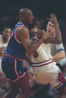 13 May 1994:  Guard Derek Harper of the New York Knicks hits a Chicago Bulls player during a second round playoff game at Madison Square Garden in New York City, New York.  The Bulls won the game, 104-102. Mandatory Credit: Jonathan Daniel  /Allsport