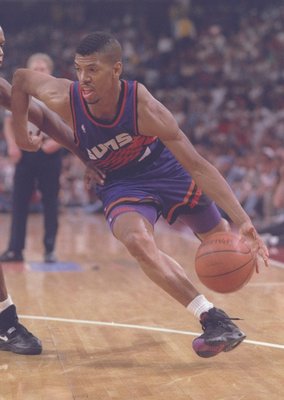 13 Jun 1993: Guard Kevin Johnson of the Phoenix Suns moves the ball during a game against the Chicago Bulls at the United Center in Chicago, Illinois. The Suns won the game, 129-121.