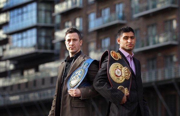 MANCHESTER, ENGLAND - FEBRUARY 08:  Amir Khan poses with his WBA light-welterweight belt as he stands alongside his next challenger for the title Paul McCloskey at a photocall at the Lowery Hotel on February 8, 2011 in Manchester, England.  (Photo by Alex