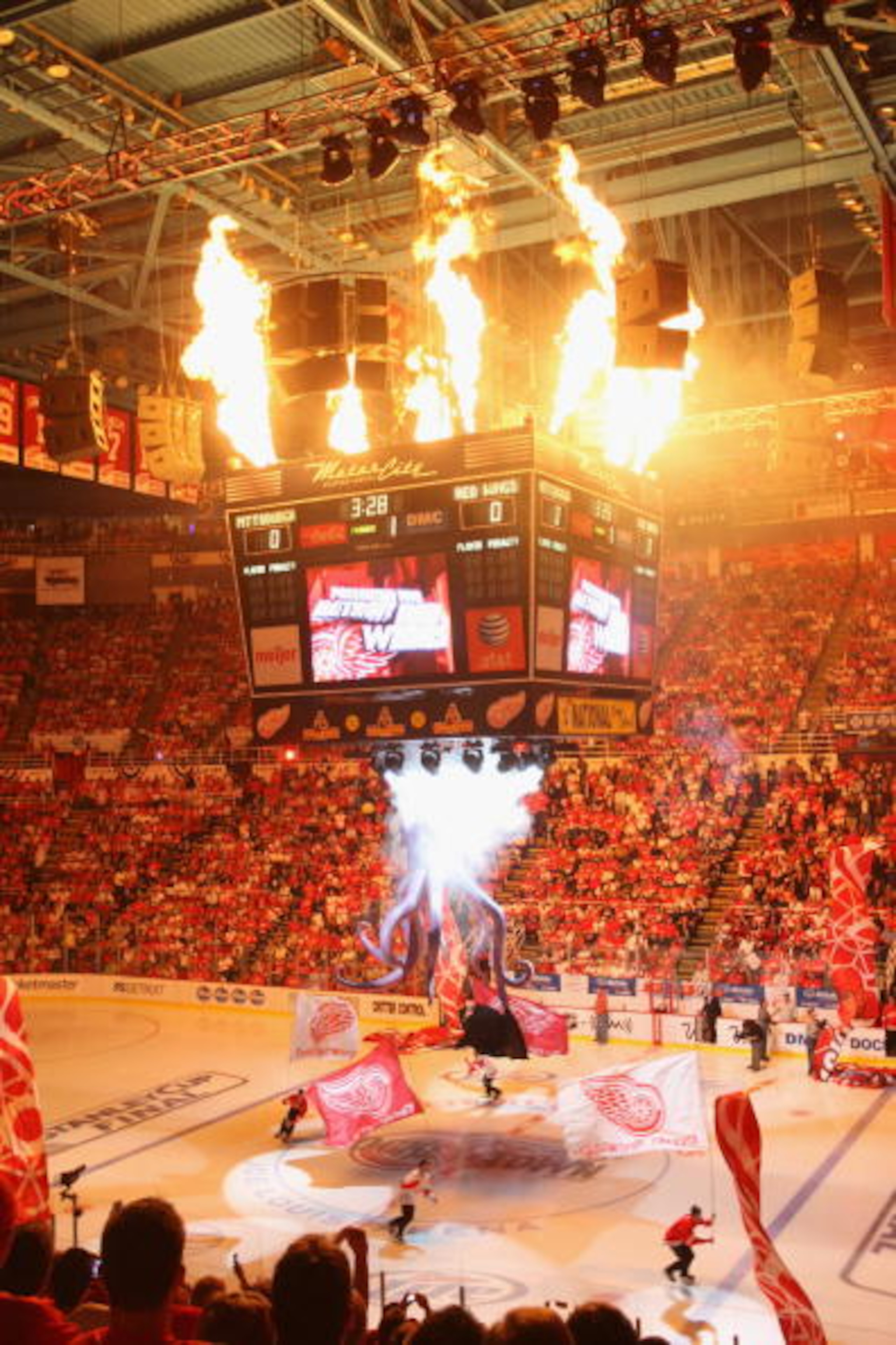 DETROIT - JUNE 6: Fireworks go off as skaters carry flags around the ice prior to the start of Game Five of the 2009 NHL Stanley Cup Finals between the Pittsburgh Penguins and the Detroit Red Wings at Joe Louis Arena on June 6, 2009 in Detroit, Michigan. DETROIT - JUNE 6: Fireworks go off as skaters carry flags around the ice prior to the start of Game Five of the 2009 NHL Stanley Cup Finals between the Pittsburgh Penguins and the Detroit Red Wings at Joe Louis Arena on June 6, 2009 in Detroit, Michigan.