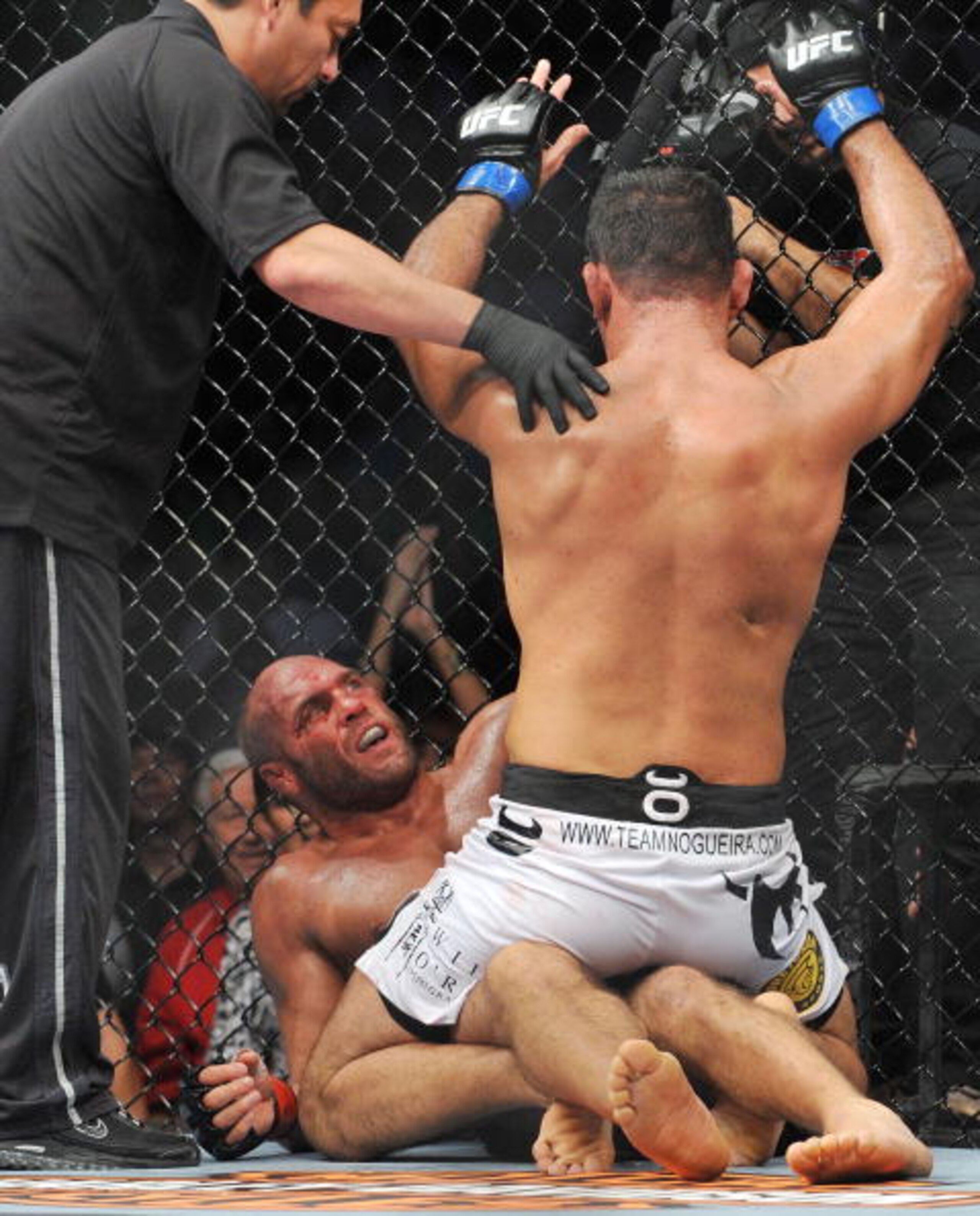 PORTLAND, OR - AUGUST 29:  UFC fighter Randy Couture (Bottom) battles UFC fighter Antonio Nogueira (Top) during their Heavyweight bout at UFC 102:  Couture vs. Nogueira at the Rose Garden Arena on August 29, 2009 in Portland, Oregon.  (Photo by Jon Kopalo