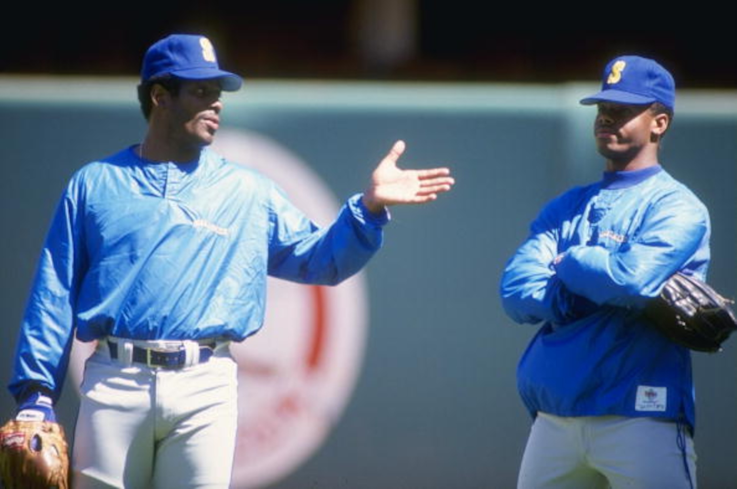 1990:  Ken Griffey Jr. of the Seattle Mariners stands with his father Ken Griffey Sr. during a game. Mandatory Credit: Ken Levine  /Allsport