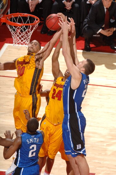 COLLEGE PARK, MD - FEBRUARY 2: Miles Plumlee #21 of the Duke Blue Devils fights for a rebound during a college basketball game against Jordan WIlliams #20 and Cliff Tucker #24 of the Maryland Terrapins on February 2, 2011 at the Comcast Arena in College P