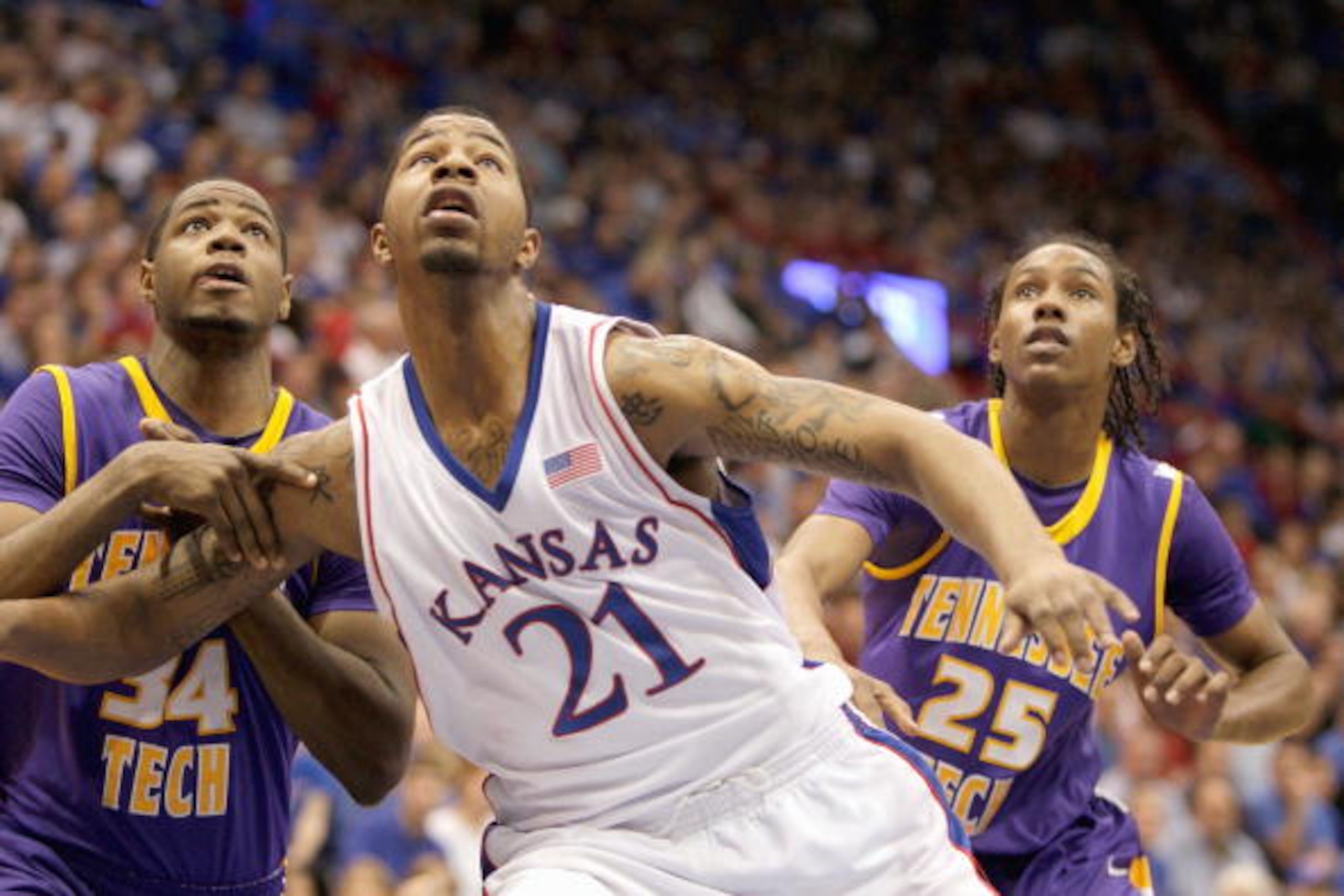 LAWRENCE, KS - NOVEMBER 27: Markieff Morris #21 of the Kansas Jayhawks looks for the rebound against Alfred Jones #34 and Jud Dillard #25 of the Tennessee Tech Golden Eagles during the game on November 27, 2009 at Allen Fieldhouse in Lawrence, Kansas. (Ph LAWRENCE, KS - NOVEMBER 27: Markieff Morris #21 of the Kansas Jayhawks looks for the rebound against Alfred Jones #34 and Jud Dillard #25 of the Tennessee Tech Golden Eagles during the game on November 27, 2009 at Allen Fieldhouse in Lawrence, Kansas. (Ph