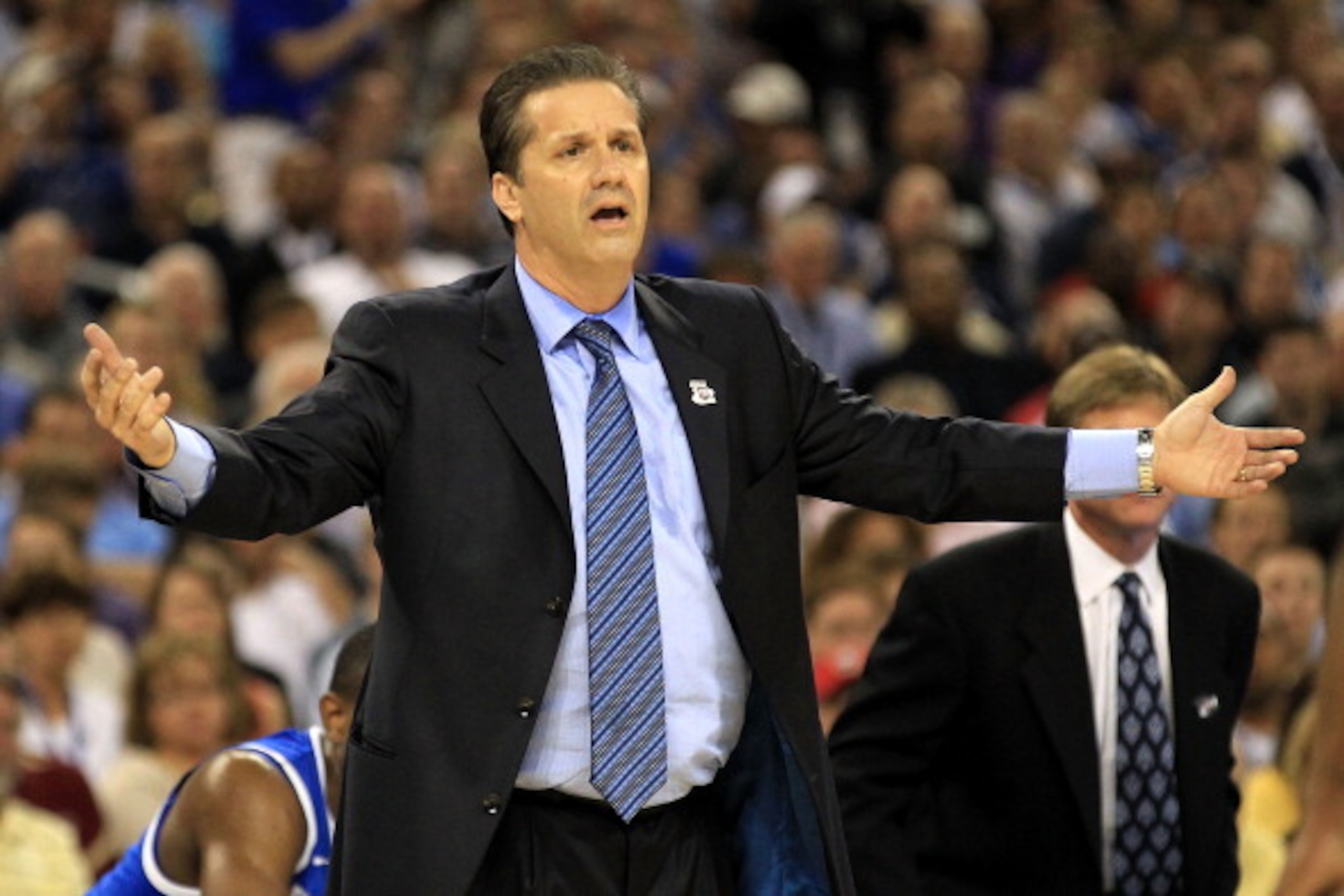 HOUSTON, TX - APRIL 02:  Head coach John Calipari of the Kentucky Wildcats gestures from the sidelines against the Connecticut Huskies during the National Semifinal game of the 2011 NCAA Division I Men's Basketball Championship at Reliant Stadium on April